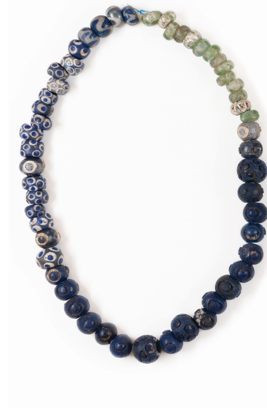 BELOW All that survives from the Queen’s Barrow at Arras excavated between 1815 and 1817 alongside the barrows of ‘the Charioteer’ and ‘the King’ are the grave goods, described as ‘a remarkable variety of interesting things’, including a glass-bead necklace, bronze bracelets, a bow brooch with sunburst inset with coral beads, and a circular bronze plaque inset with concentric rings of white coral and red stone, ceramic, or ochre. Equally remarkable is that many of the items were ancient by the time they were buried: the ‘Queen’ in the barrow might have been the last to inherit these adornments from a significant ancestor.