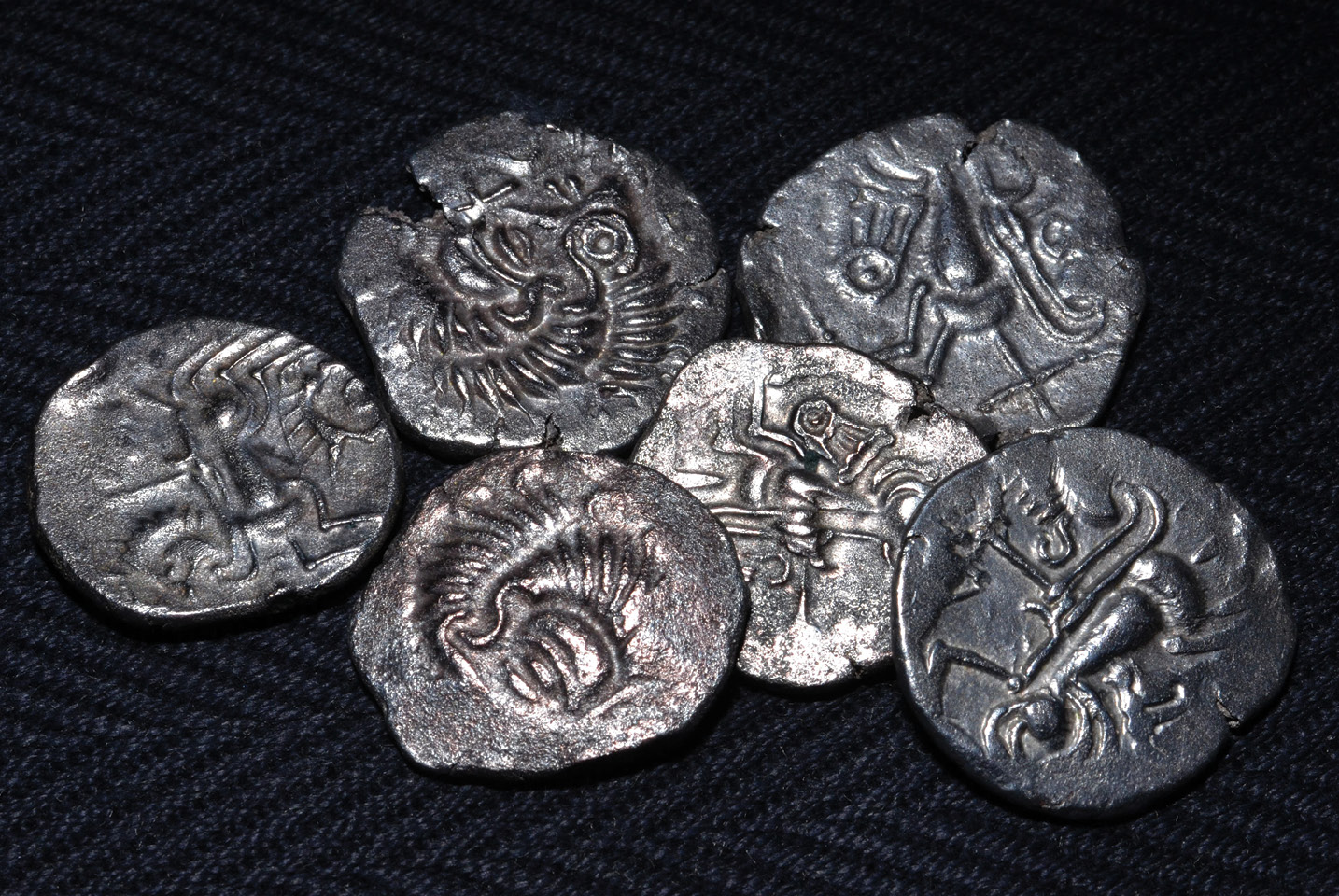 ABOVE Some of the cleaned staters from Le Câtillon II. The hoard has been linked to the Coriosolitae tribe who lived in Armorica, in modern Normandy. These examples show their original appearance, but most of the coins were cleaned only enough to allow identification, due to the sheer number that the hoard contained.