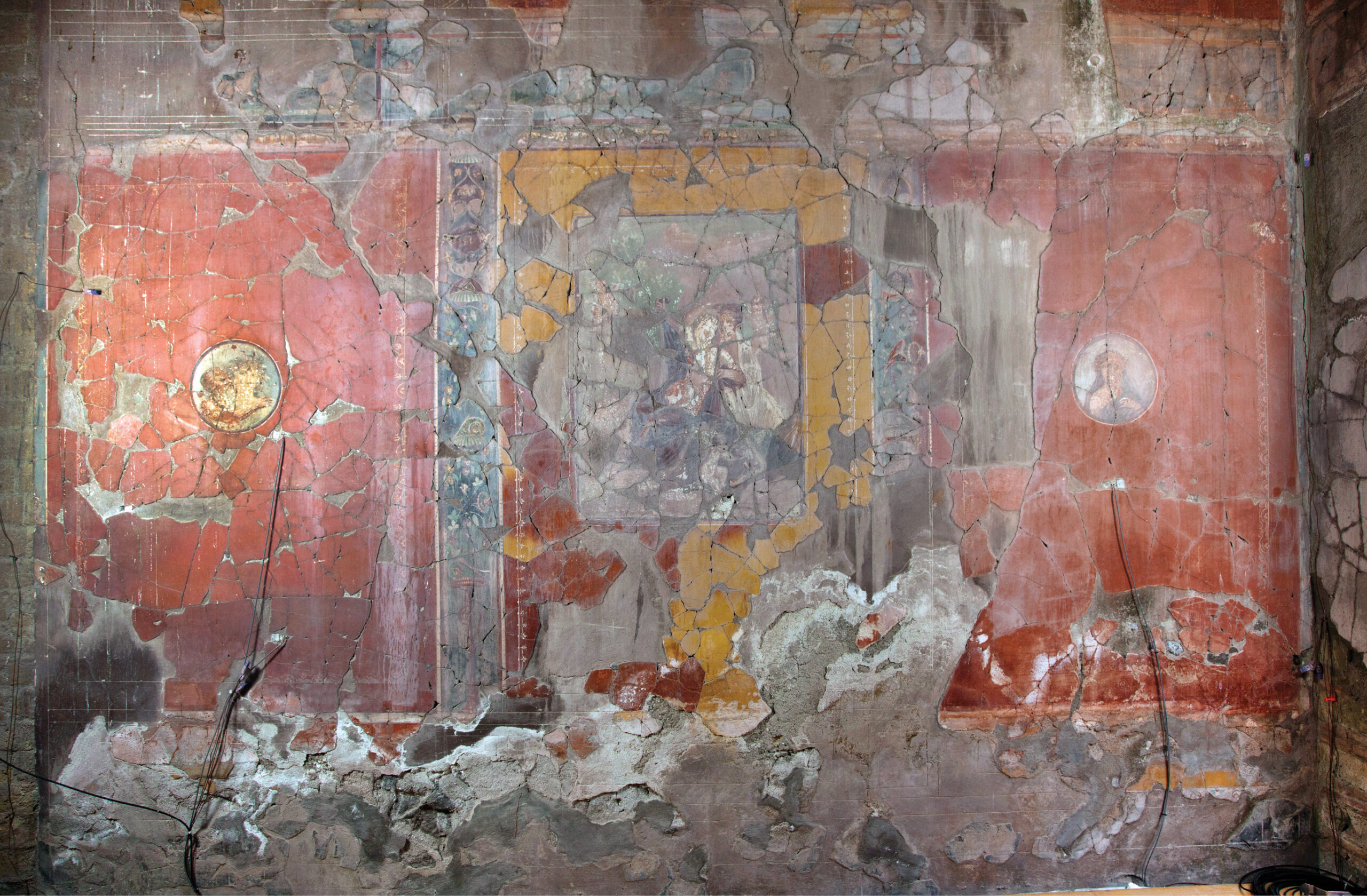 below From the 1980s, the House of the Bicentenary was closed to visitors due to structural issues and deferred maintenance. This led to severe deterioration of the wall paintings and mosaics. Salt activity from rising damp led to erosion and loss of paint along the base of the wall, and water infiltration from roof leaks left drips down the surface.