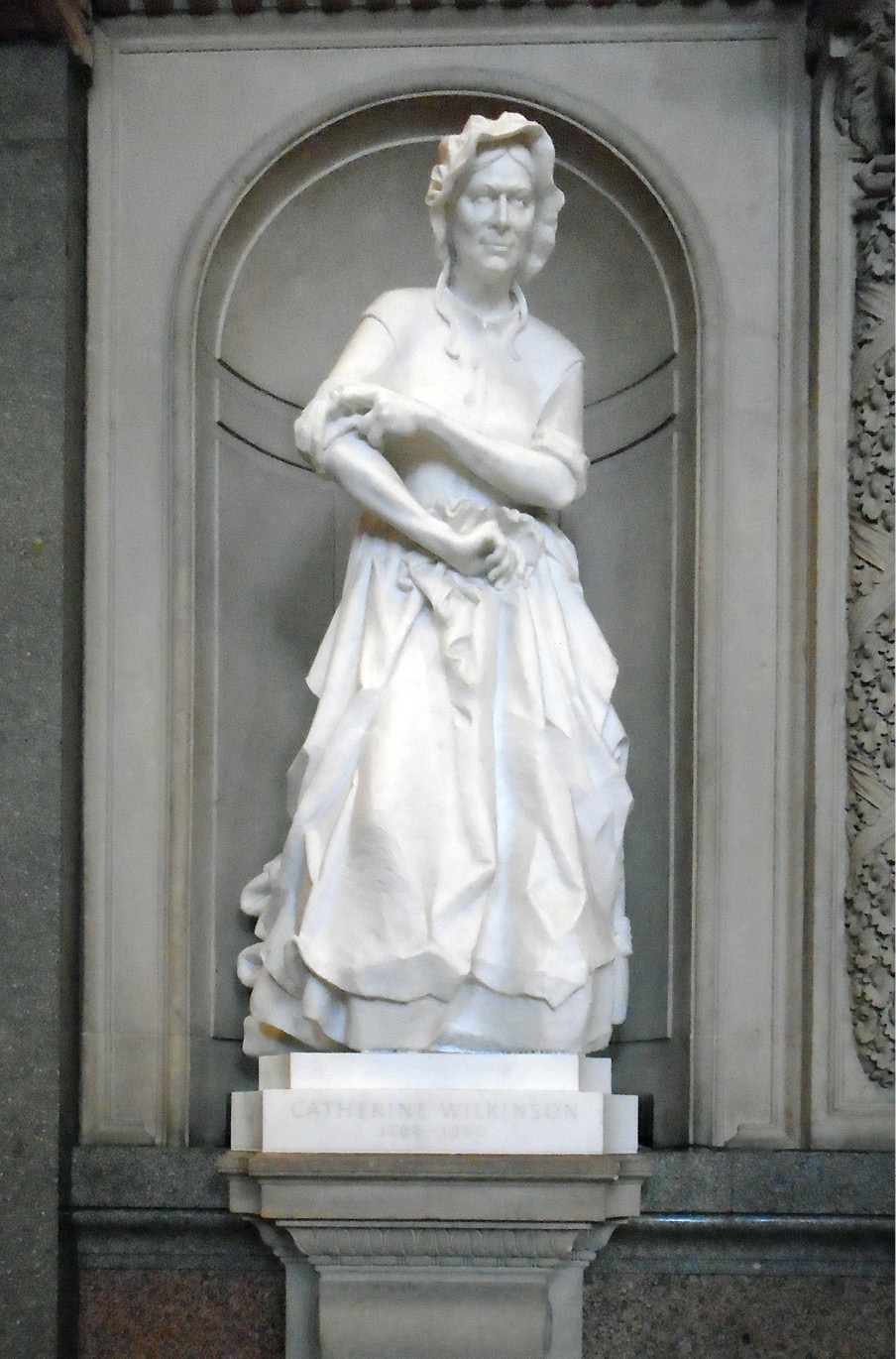 LEFT & BELOW Kitty Wilkinson campaigned tirelessly for the provision of public washing facilities for the poor. Today she is commemorated by her gravestone in the grounds of Liverpool’s Anglican cathedral, as well as by a statue that was installed in the city’s St George’s Hall in 2012.