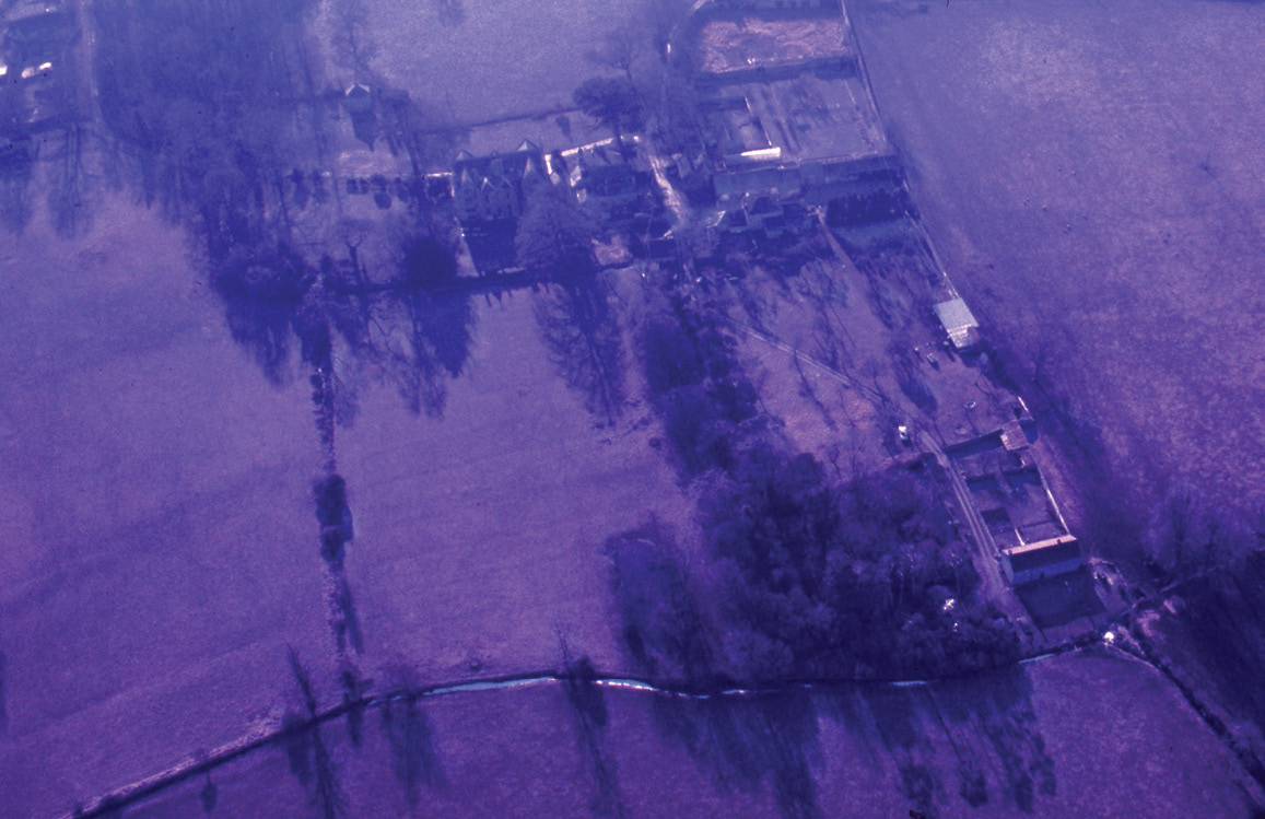 below Aerial photograph of Shapwick, Somerset, taken 30 January 1987. The two images show dye-colour degradation (HEIR ID 64884) and the same photograph with digital colour-correction.