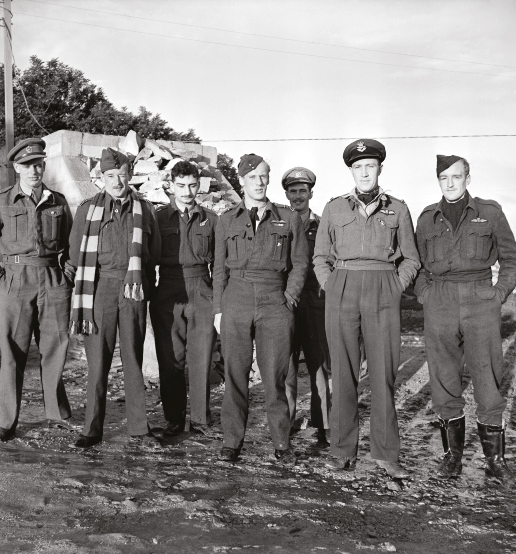 ABOVE Wing Commander Adrian Warburton (centre), Commanding Officer of No.69 Squadron RAF, with his crew in Malta during the Second World War. Alec Guinness played a loose version of ‘Warby’, who went missing over Germany in 1944.