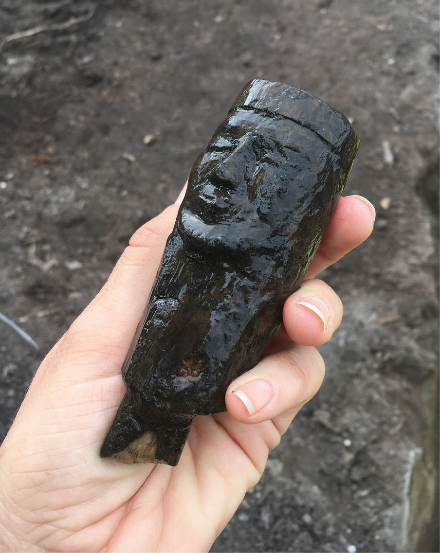 LEFT The waterlogged deposits permitted spectacular preservation of wooden artefacts. This 13th- century wooden head, which probably belonged to a staff, was found lying in a medieval ditch.