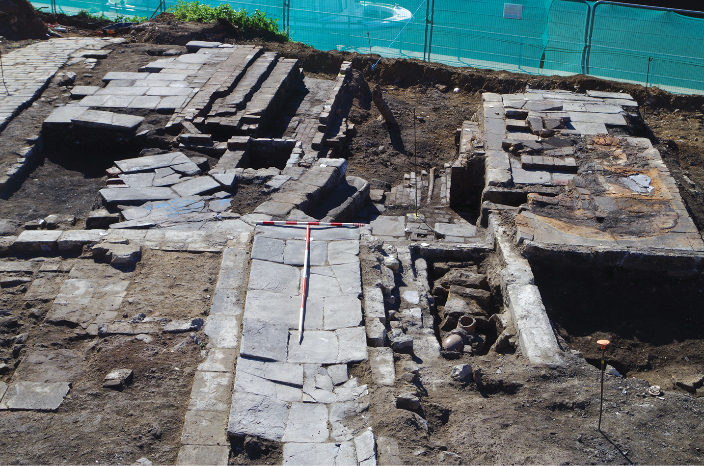LEFT Excavating the boiler room, showing steam boiler bases dating from the wash house’s expansion in 1853. The top image shows the cubicles of the site’s laundry stalls.