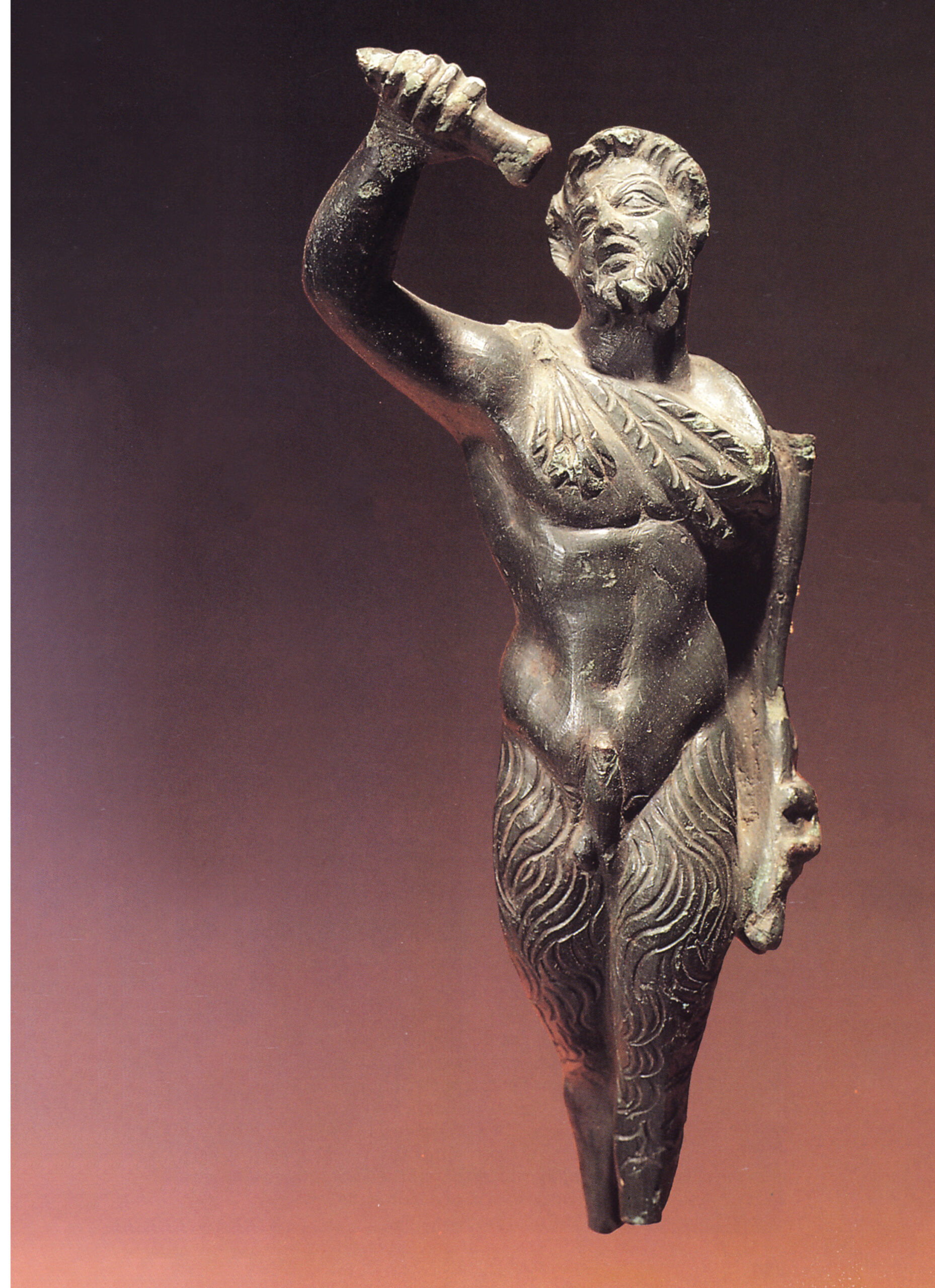 RIGHT Pan, as depicted on the bronze statuette found as a gun battery was being constructed on Mount Mile in 1981. The god is shown with a bearded human face, discreet horns, and goat-legs. He is pouring oil from an alabastron. Mount Mile overlooked the ancient city of Butrint, which features in the story surrounding the god’s demise.