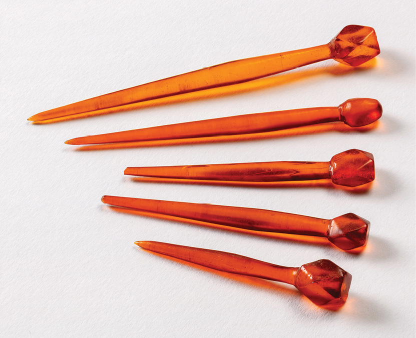 RIGHT Amber pins were found at the feet of the individual buried in the largest sarcophagus, dating to the 4th century