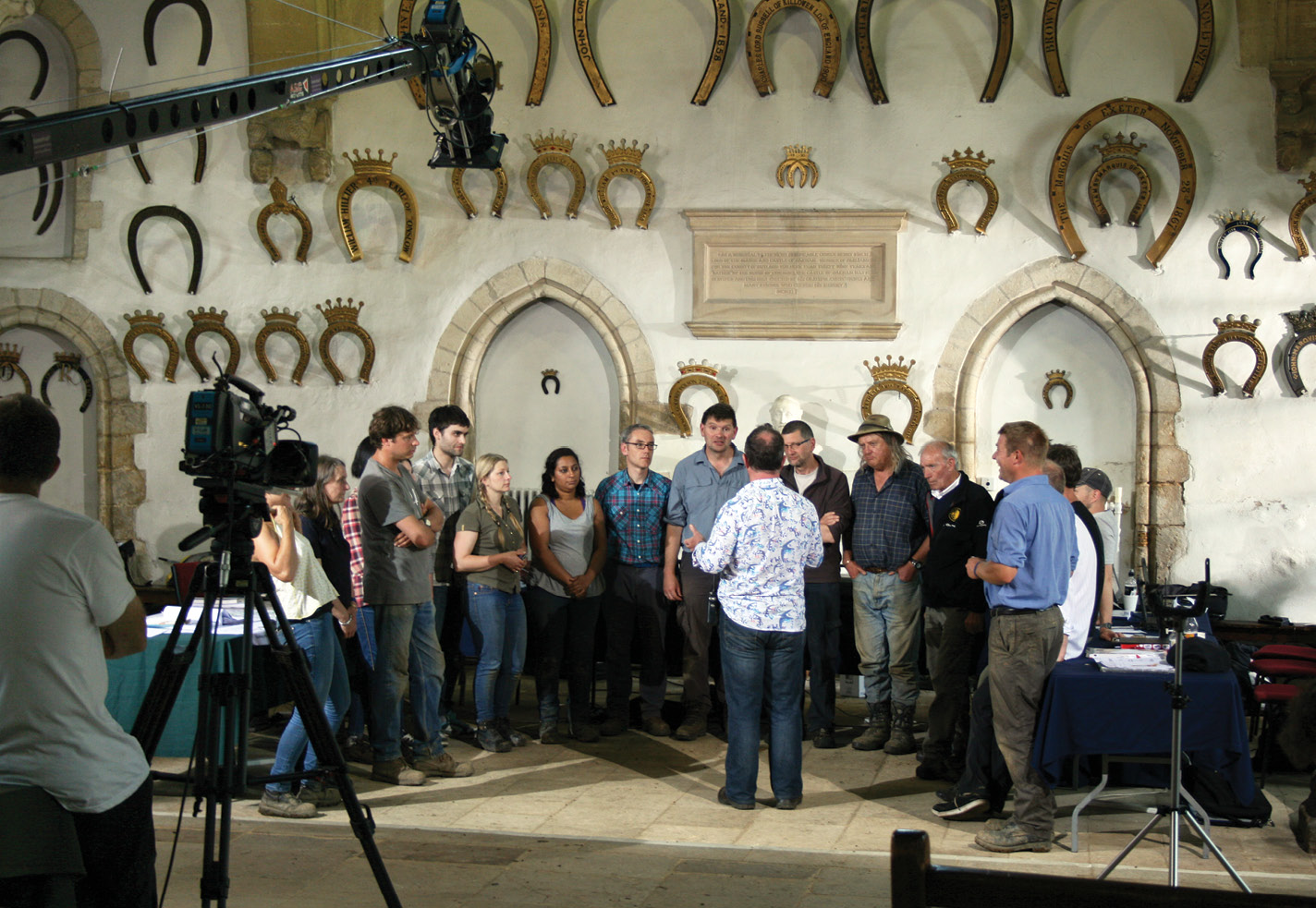 right The team being directed inside the magnificent 12th-century great hall at Oakham Castle for the final shot of an episode in the forthcoming season 20. The ornate horseshoes stem from a tradition dating back to Edward IV in 1470 that peers of the realm should donate one when they visit. A local blacksmith cast a special horseshoe in honour of Time Team’s visit (inset).
