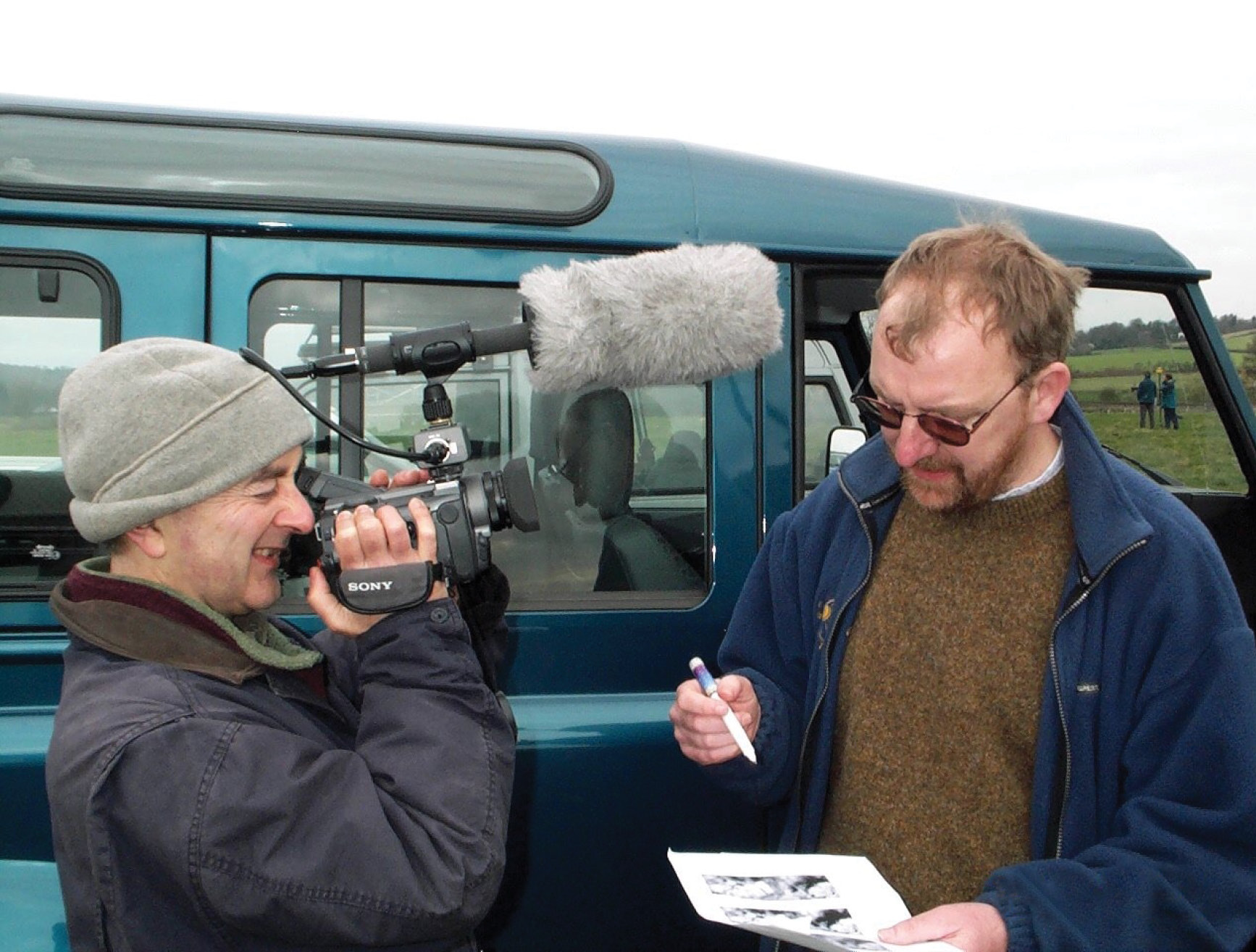 right Tony Robinson takes a turn behind the camera to quizz John on geophysiscs results. below inset John Gater with a Geoscan resistance meter.