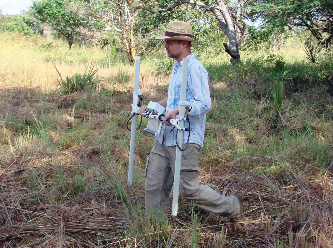 above Jimmy Adcock of GSB Prospection Ltd, carries a Bartington gradiometer.