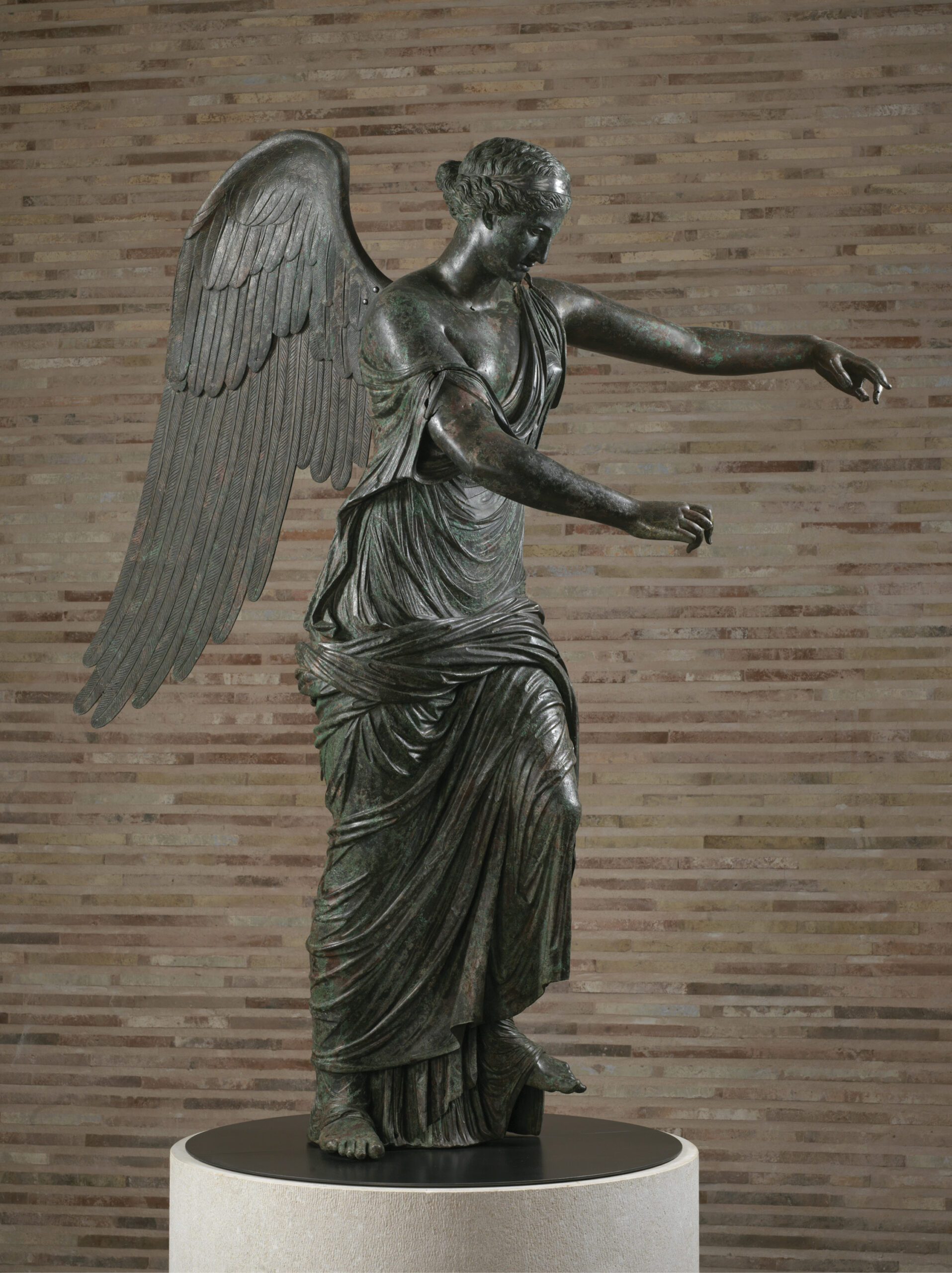 OPPOSITE The Winged Victory back on view, in a space designed by architect Juan Navarro Baldeweg.