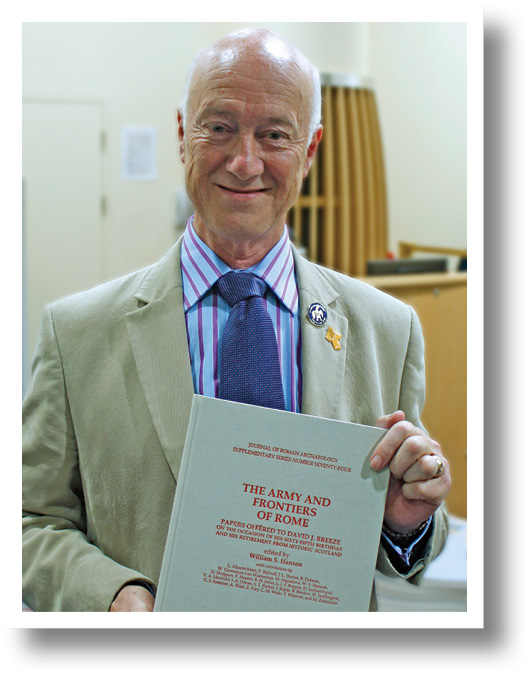 David Breeze accepts his festschrift, prepared in secret, and presented at the Limes
