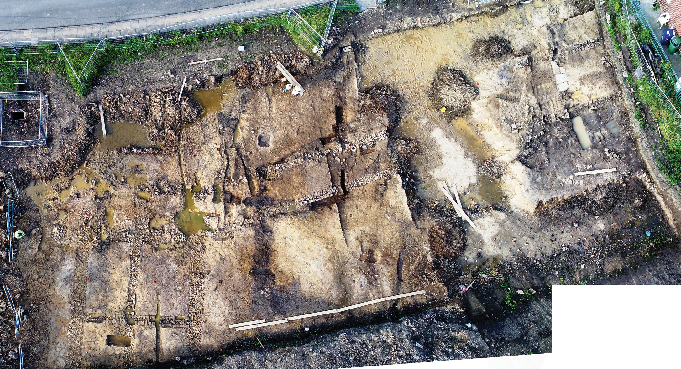 above Several excavations over the last decade have demonstrated the scale of activity outside Benwell fort. Here, Roman buildings to the south of the fort and forming part of its extramural settlement are being excavated in advance of development.
