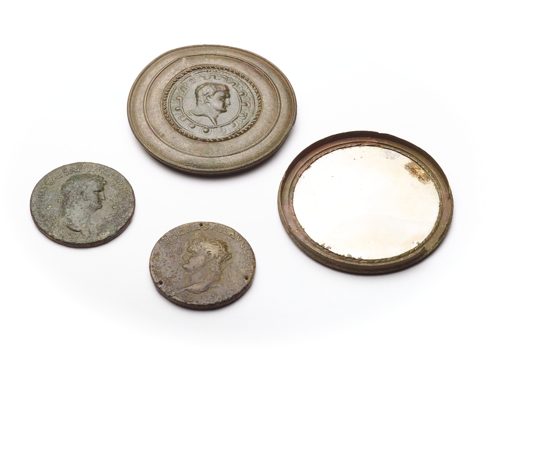 left These are mirror cases decorated with coins bearing Nero’s portrait. Found near Paris in France and Coddenham in Suffolk, they are thought to represent supporters of the emperor unlike public displays of loyalty, which may have been driven by political expediency or self-interest, the incorporation of Nero’s image into a personal object like this might hint at more genuine admiration.