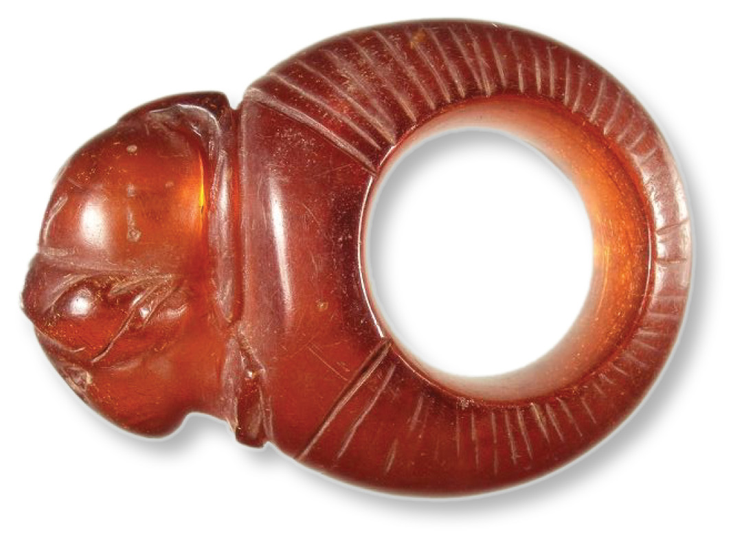 left & above Two high-status finds recovered from the northern Lanes site: an amber finger-ring depicting the goddess Minerva, found in a 3rd-century deposit, and a statuette of Diana from a later deposit nearby.