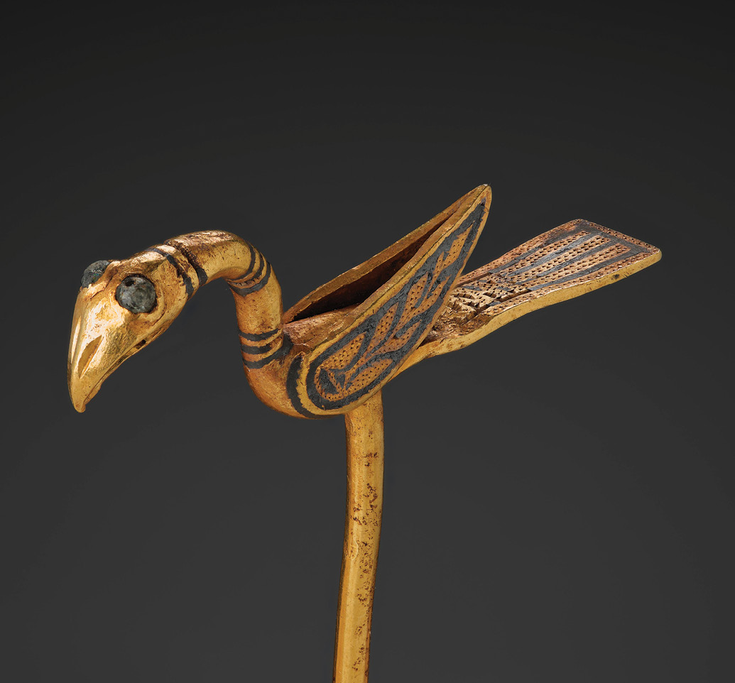BELOW The delicate pin in the shape of a bird is shown here in greater detail. Compared to silver, gold objects are relatively rare in Viking Age hoards.