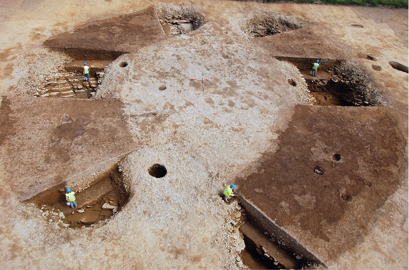 left Overlooking the remains of the henge, along the axis of its two entrances which were aligned on sunrise and sunset at the two solstices. Its curved rock-cut ditches would once have been flanked by imposing ditches, and post- or stone-holes visible within the ditches (prior to erosion they would have been located around 1m from their inner edge) may have supported an arrangement of timber or stone uprights.