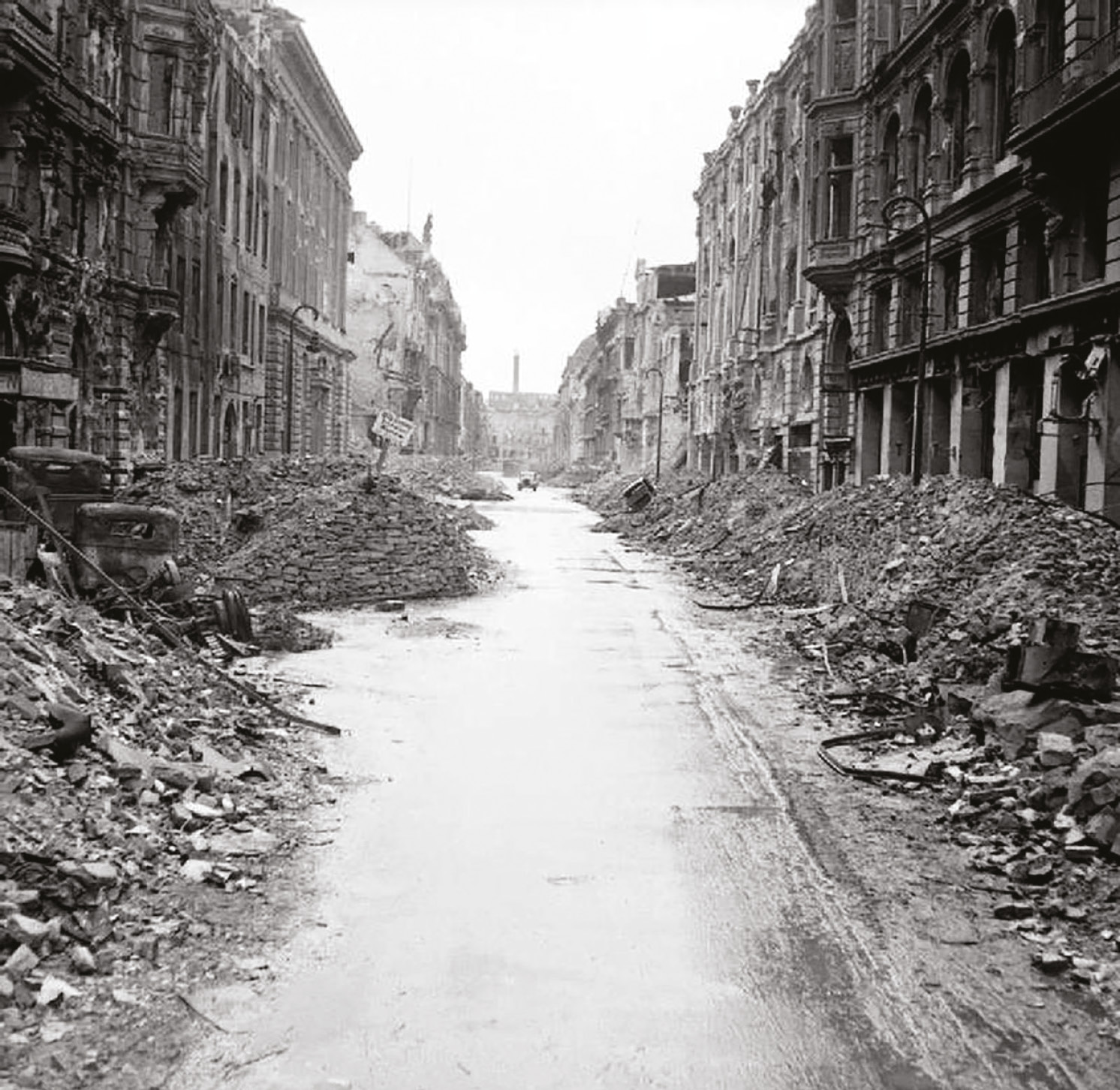 Images of a defeated city. ABOVE A ruined Berlin street just off the Unter den Linden. BELOW Some of the prisoners taken in the battle, mainly older Volkssturm men.