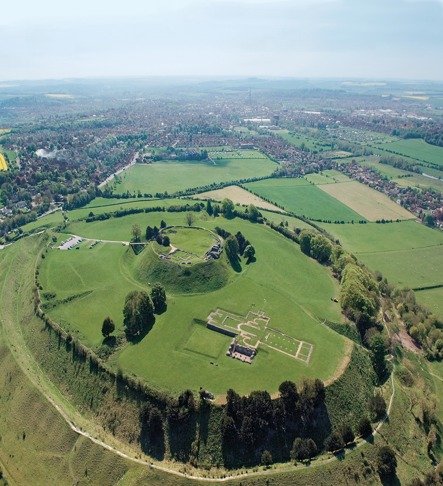 above Old Sarum. The now demolished great tower stood on top of the massive earthworks of the earlier Norman motte, which itself occupies an Iron Age hillfort, standing alongside the ruins of the