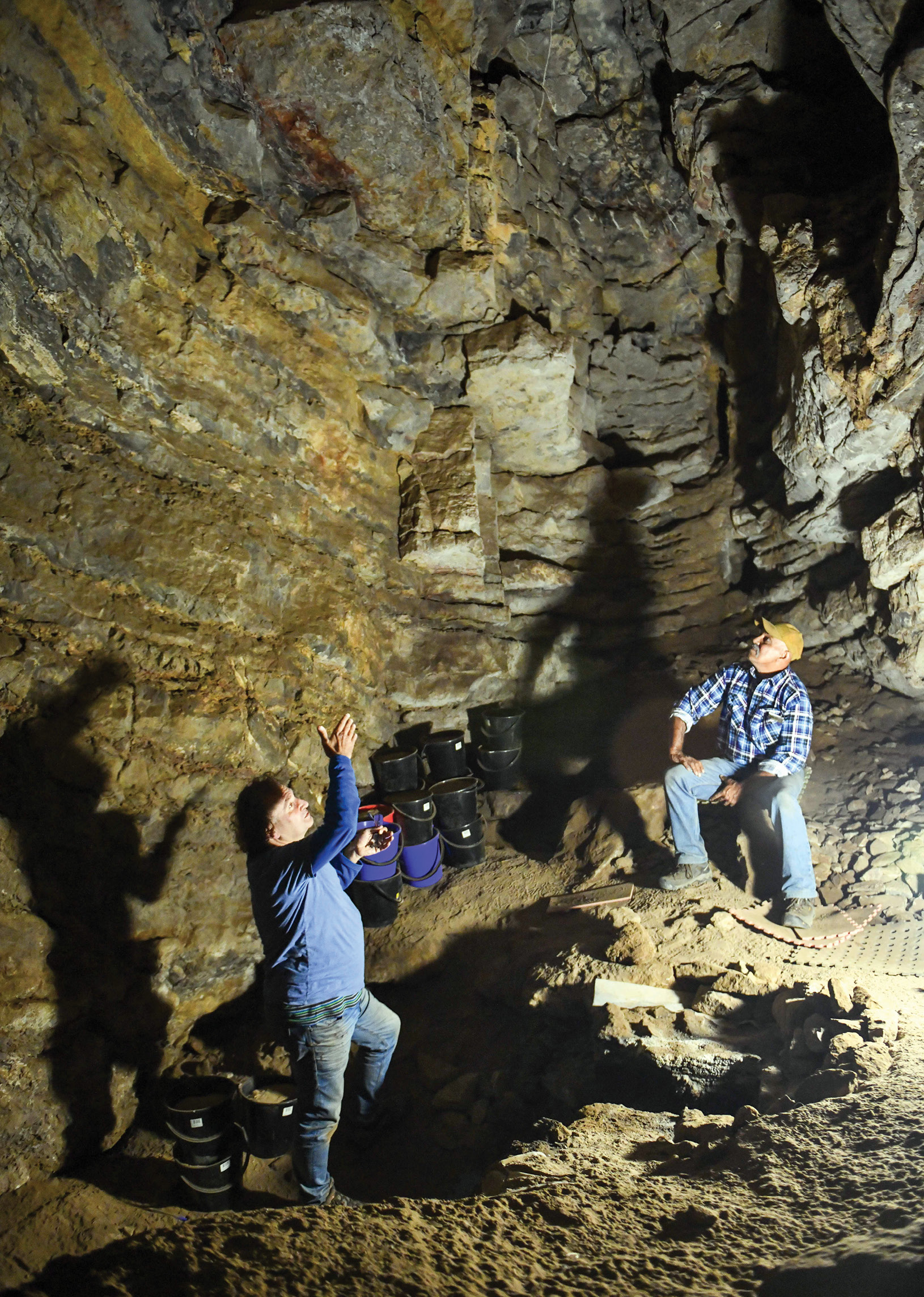 left Prof. Bruno David (on the left) and GunaiKurnai Elder Russell Mullett (right) inside Cloggs Cave.