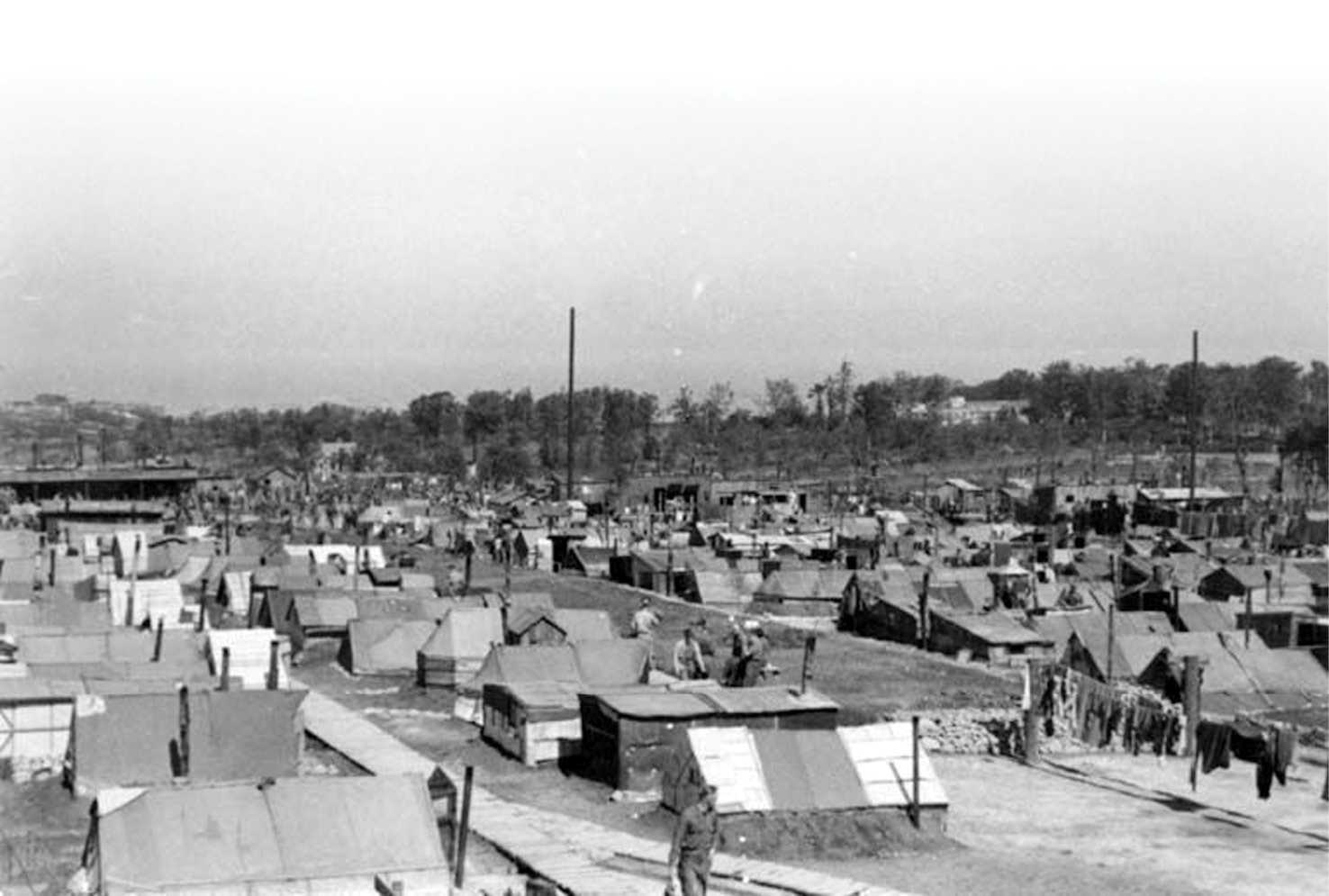 righT & below Red Cross photos of the compound and of one of the sunken-featured structures, clearly showing the chimney pipe from the tent’s stove.