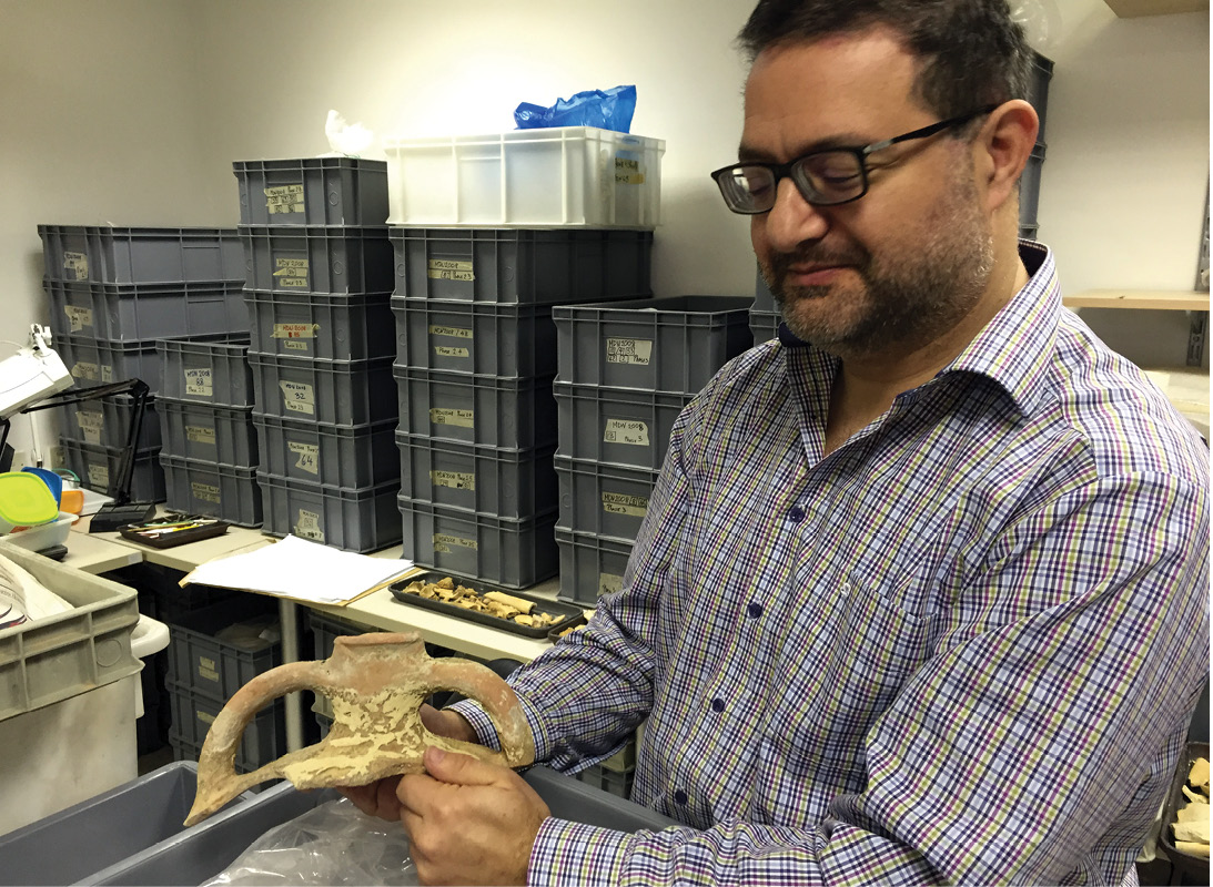left Well met: Nathaniel Cutujar, Deputy Superintendent with Heritage Malta, has worked on numerous rescue excavations throughout the island; he is shown here with the remains of an imported amphora. below A miniature megalithic sculpture of a resting woman, from the National Archaeology Museum.