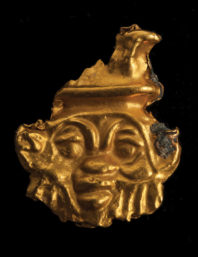 BELOW RIGHT A gold face of the Egyptian god Bes, dating from the 5th-4th century BC and found at the edge of the burial area.