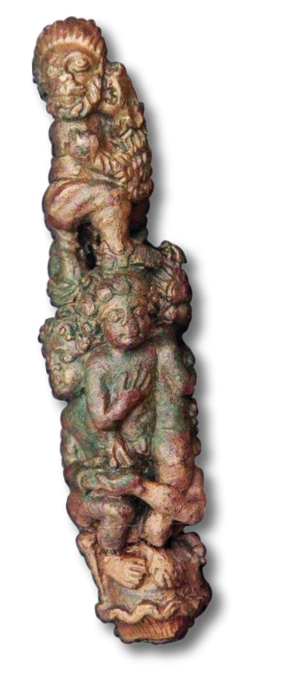 right This ornate handle, possibly for a knife or a key, was found in the townhouse with the fine mosaic. It depicts a man being attacked by a lion, possibly an arena scene.
