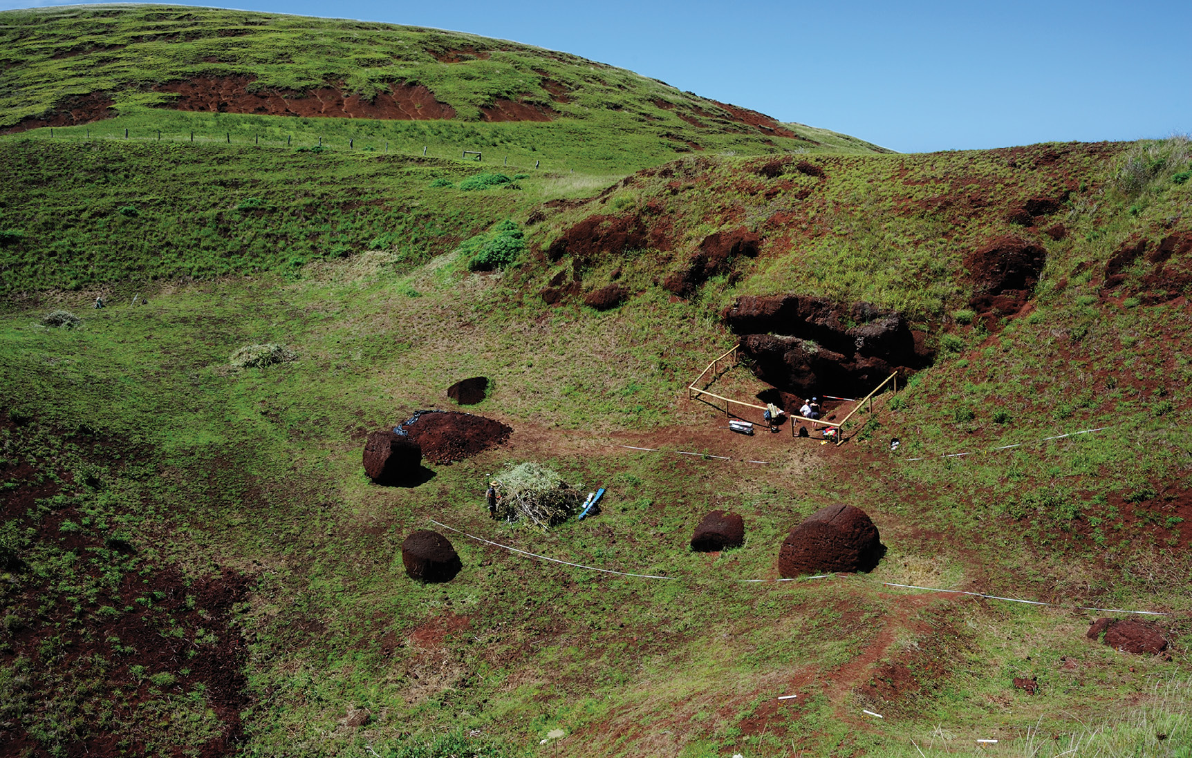 BELOW As part of the Rapa Nui: landscapes of construction project, excavations at Puna Pau revealed the methods employed in cutting the red scoria cylinders (pukao) from the living rock. Abandoned pukao can be seen lying on the floor of the volcanic cone.