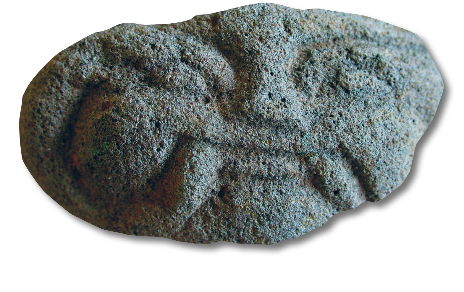 Above A small ornamental mask. Found with the green masks, and made of the same material, this can be dated on stylistic grounds to the 13th or 14th century. Aboveright A length of brick roofing under excavation.