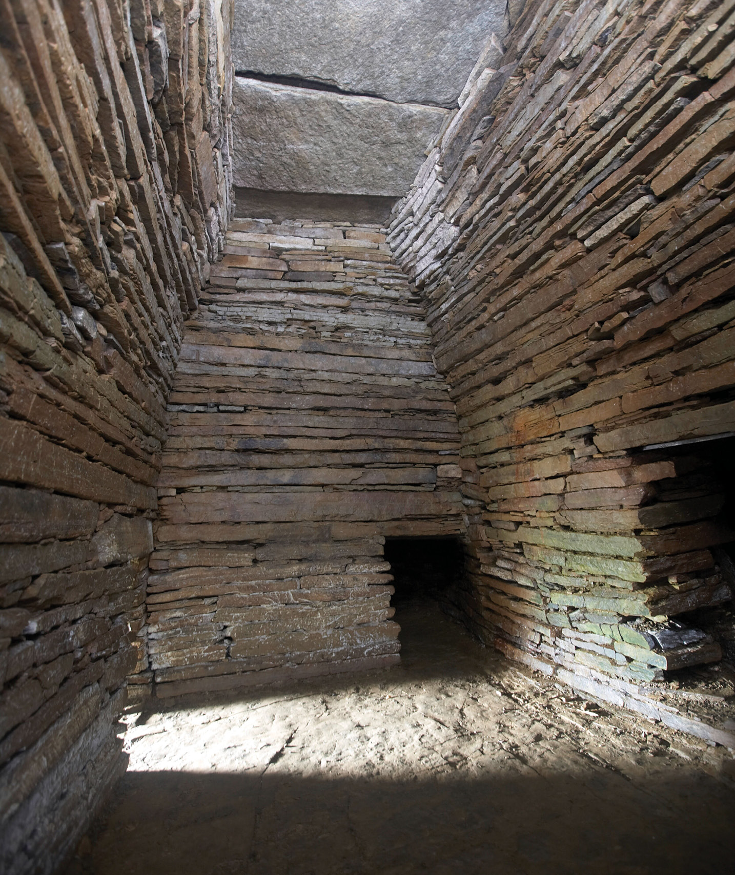 below A photograph of Cuween chambered cairn. Digital technology allows sites like this to be explored remotely in remarkable detail.