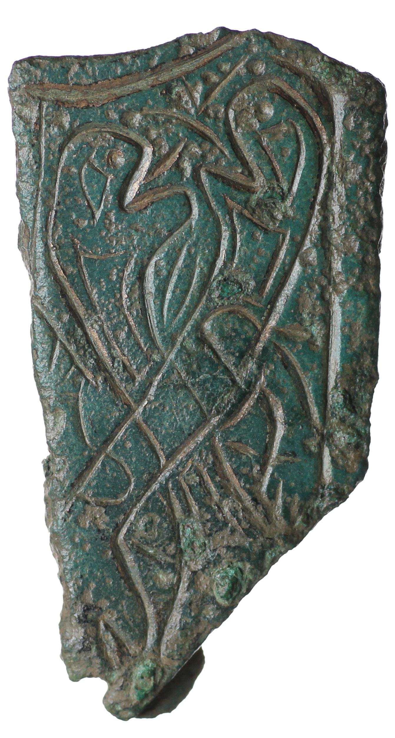 OPPOSITE Fragment of a decorative copper-alloy mount, with two crudely inscribed intertwined snake-like beasts with biting heads, found at Aldwark, North Yorkshire.