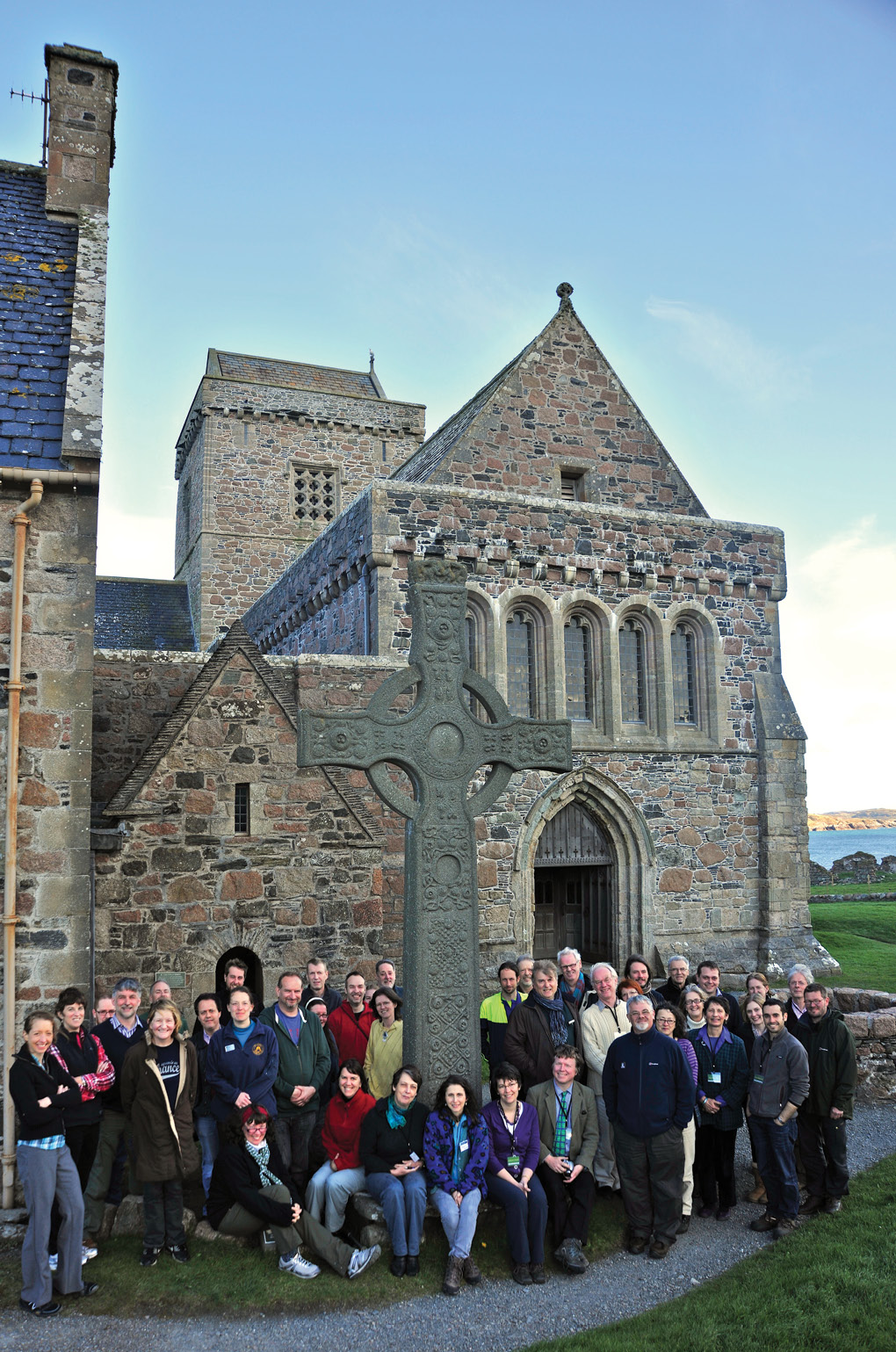 TOP RIGHT Delegates of the Iona 2012 conference stand beside St John’s cross, one of the island’s most striking Medieval monuments, outside the monastery’s shrine chapel. The author is standing second from the right of the cross. RIGHT The recent conference held on Iona launched a complete redesign of the island museum, in order to show its collection of Early Medieval stone crosses and finely carved grave-slabs to their best advantage. This example, decorated with a Scandinavian-style longship, is thought to date from the period when Viking raiders began to convert to Christianity and settle on Iona.