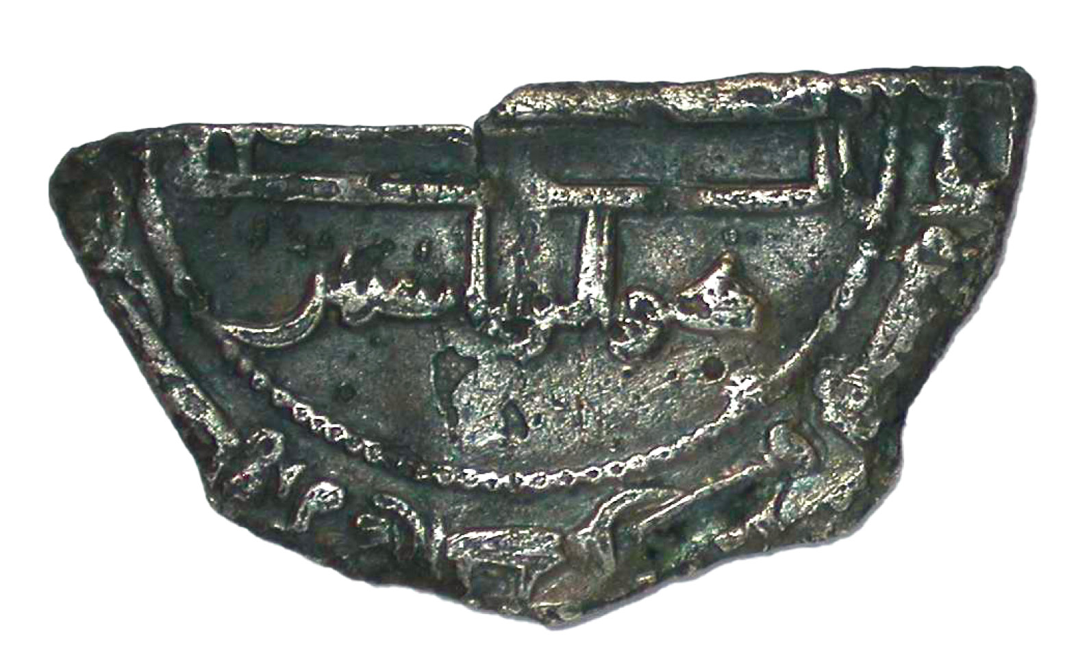 ABOVE An Islamic dirham found at Torksey, cut up for use as bullion.