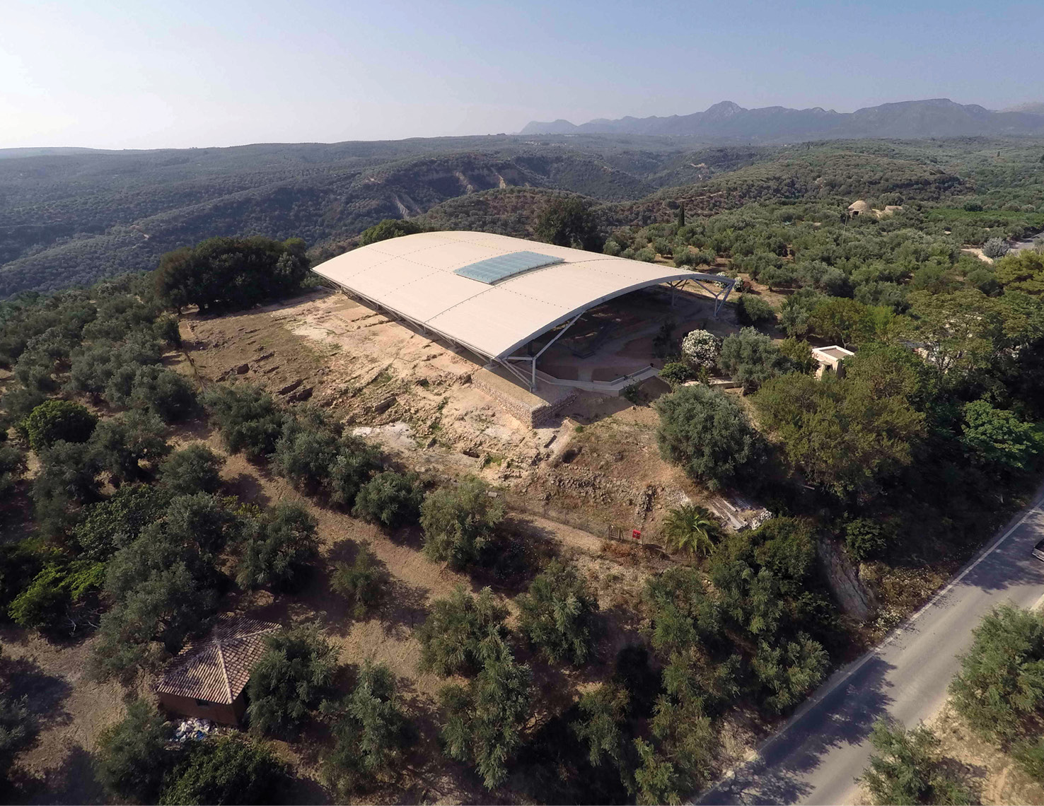 above A general overview of the site of the Palace of Nestor at Pylos. right In 1939, Carl Blegen discovered clay tablets inscribed with Linear B script that refer to the wanax, or king, at Pylos.