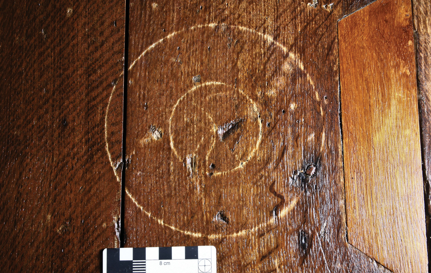 left Modern development means that, if the stable block was once extensively graffitied, its 17th-century markings have since been lost. However, a large compass-drawn ‘double circle’ on the door leading into the Riding School hints that there may once have been protective symbols in the building.