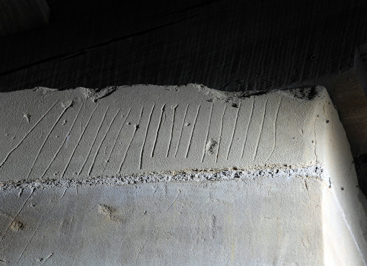 above Some of the markings surrounding the Riding School windows: tally marks from window three (left) and compass-drawn designs from window five (right).