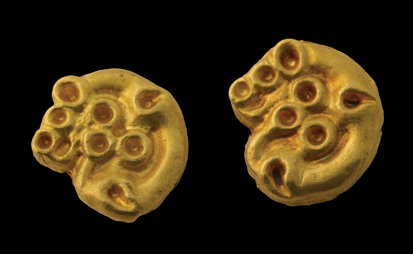 BELOW These two gold plaques, shaped like feline predators curled into a ring, were also found in Eleke Sazy Kurgan 4. They may have been intended to impart the qualities of these animals to their owner.