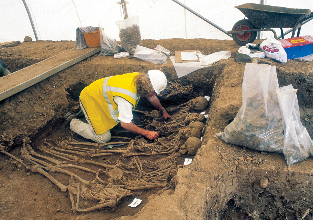 below The pits associated with the 1258 eruption typically contain between 20 and 40 bodies. Two layers of bodies are visible in the pit to the right, showing how the dead were piled on top of each other before the burial was sealed.