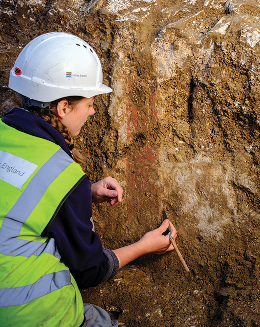 left Archaeologists have found traces of painted plaster on the arena wall of Richborough amphitheatre.