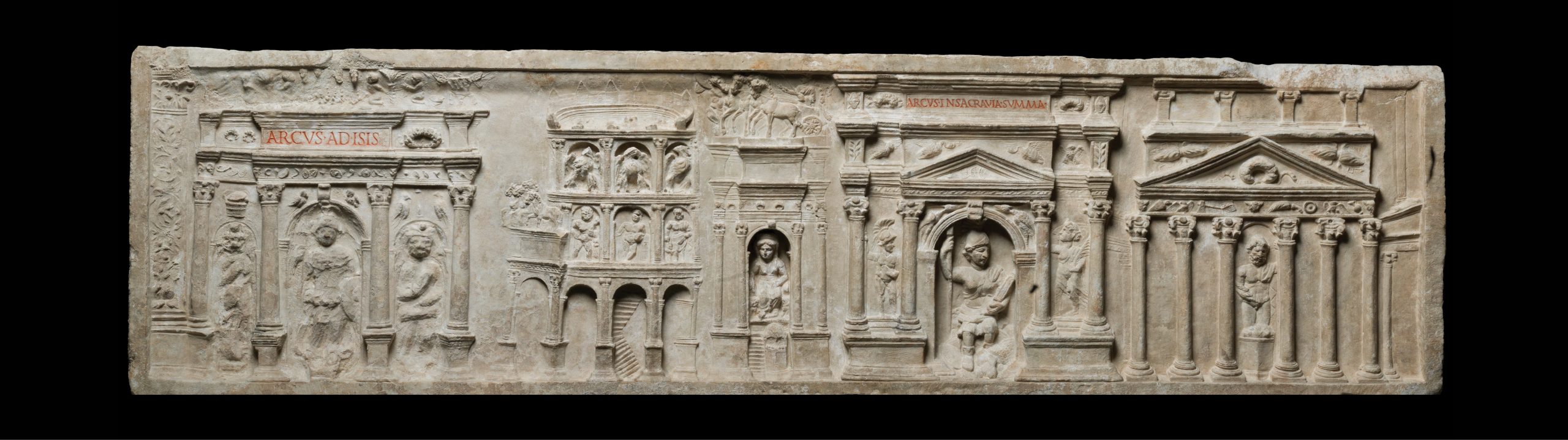 below Marble relief from the Tomb of the Haterii, a family of building contractors in Flavian Rome. The relief depicts, from left to right, the Temple of Isis and Serapis, the Colosseum, a triumphal arch (probably the first Arch of Titus in the Circus Maximus), an arch from a building near the Colosseum, and (possibly) a temple on the slope of the Palatine Hill. Rome, AD 100-120. Size: 43cm x 157cm x 24cm