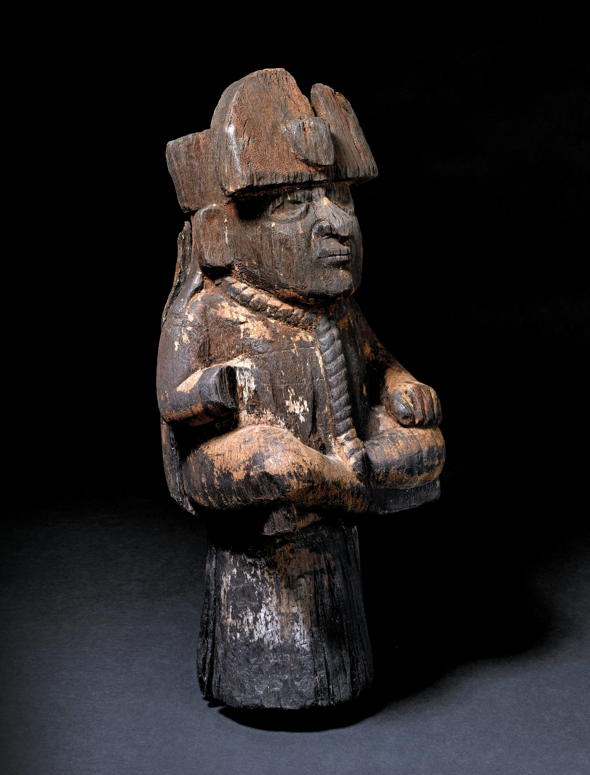 opposite Figure depicting a bound prisoner with a headdress and rope around his neck, from the Macabi Islands. Wood; Moche, AD 100-800. Size: 49.5cm x 24.6cm x 24.6cm above left Humanised owl playing pan-pipes, from the Macabi Islands. Wood; Moche, AD 100-800. Size: 25.2cm x 10.7cm x 4.6cm above right Vessel in the form of an anthromorphic deer shown as a captive warrior. Pottery; Moche, AD 100-800. Size: 24cm x 13.3cm x 21.8cm