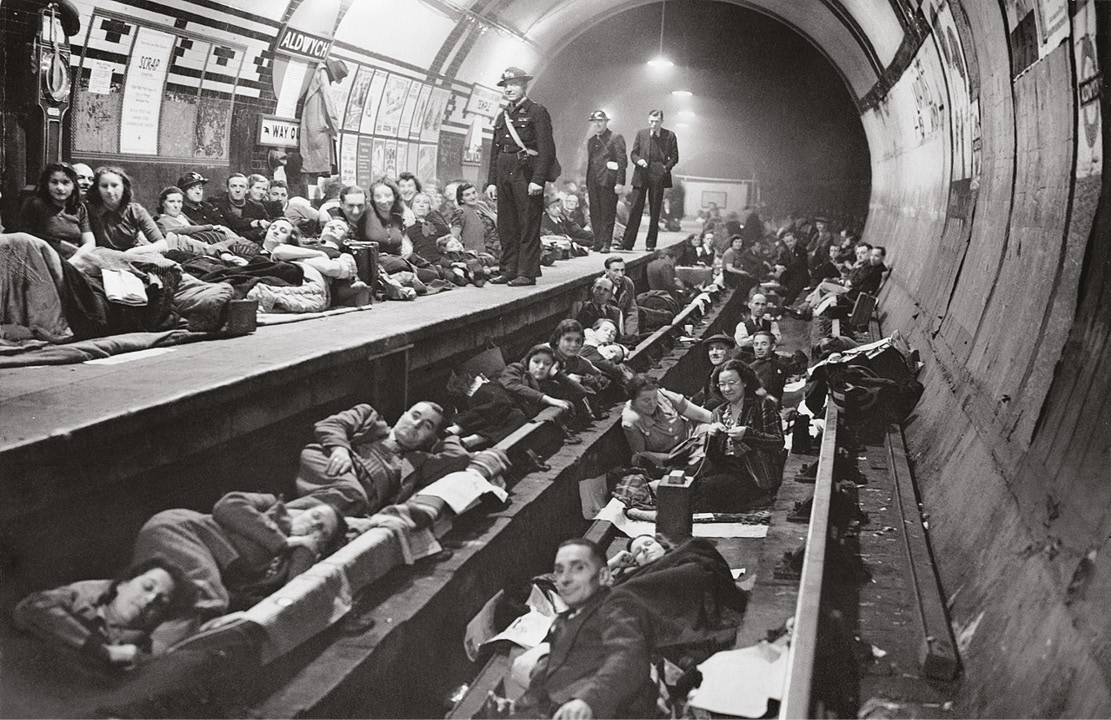 BELOW A London tube station being used as a bomb shelter during the Blitz. The war blurred the conventional line between civilian and military participants.