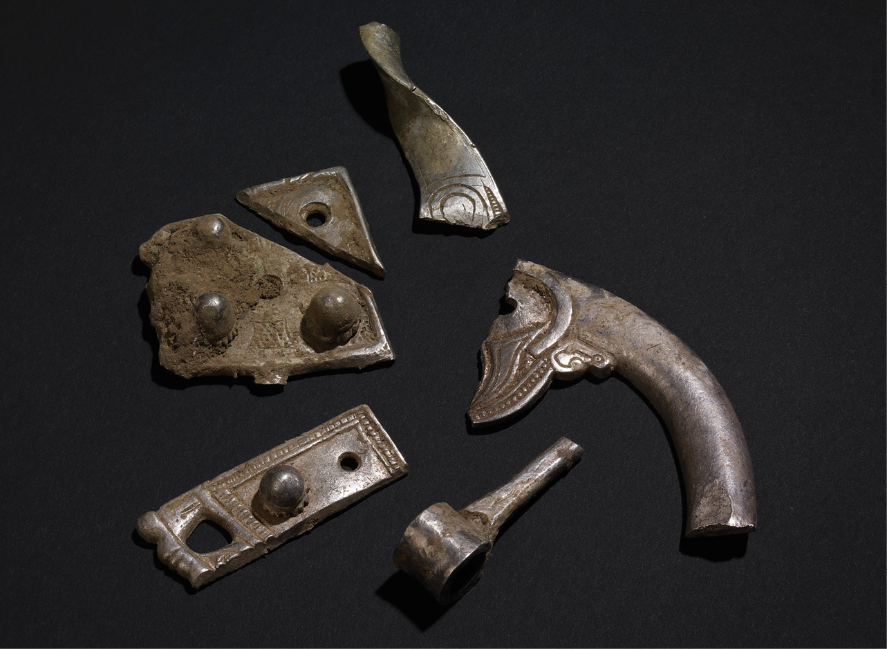 ABOVE The view from Silverdale across Morecambe Bay, traditionally seen as a landing ground for Vikings travelling from the Isle of Man of Ireland. TOP Pieces of ‘hack-silver’. Used as bullion, these pieces are brooch fragments of mainly Irish type.