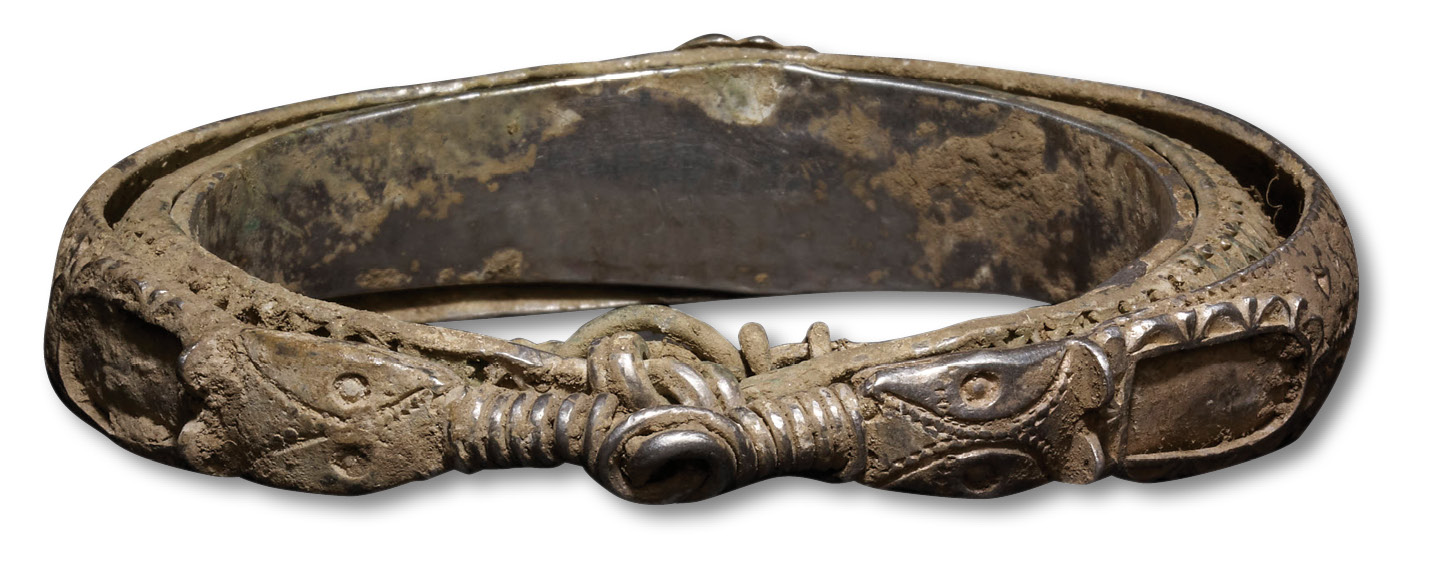 ABOVE The finely decorated animal-head terminals on the outer of the three arm-rings forming a ‘nest’. Although the arm-ring is of a Scandinavian type, the animal heads display Irish influence. INSET A punch-decorated arm-ring that appears to have been made to match a specific Viking unit of weight. BELOW The view down into Silverdale.