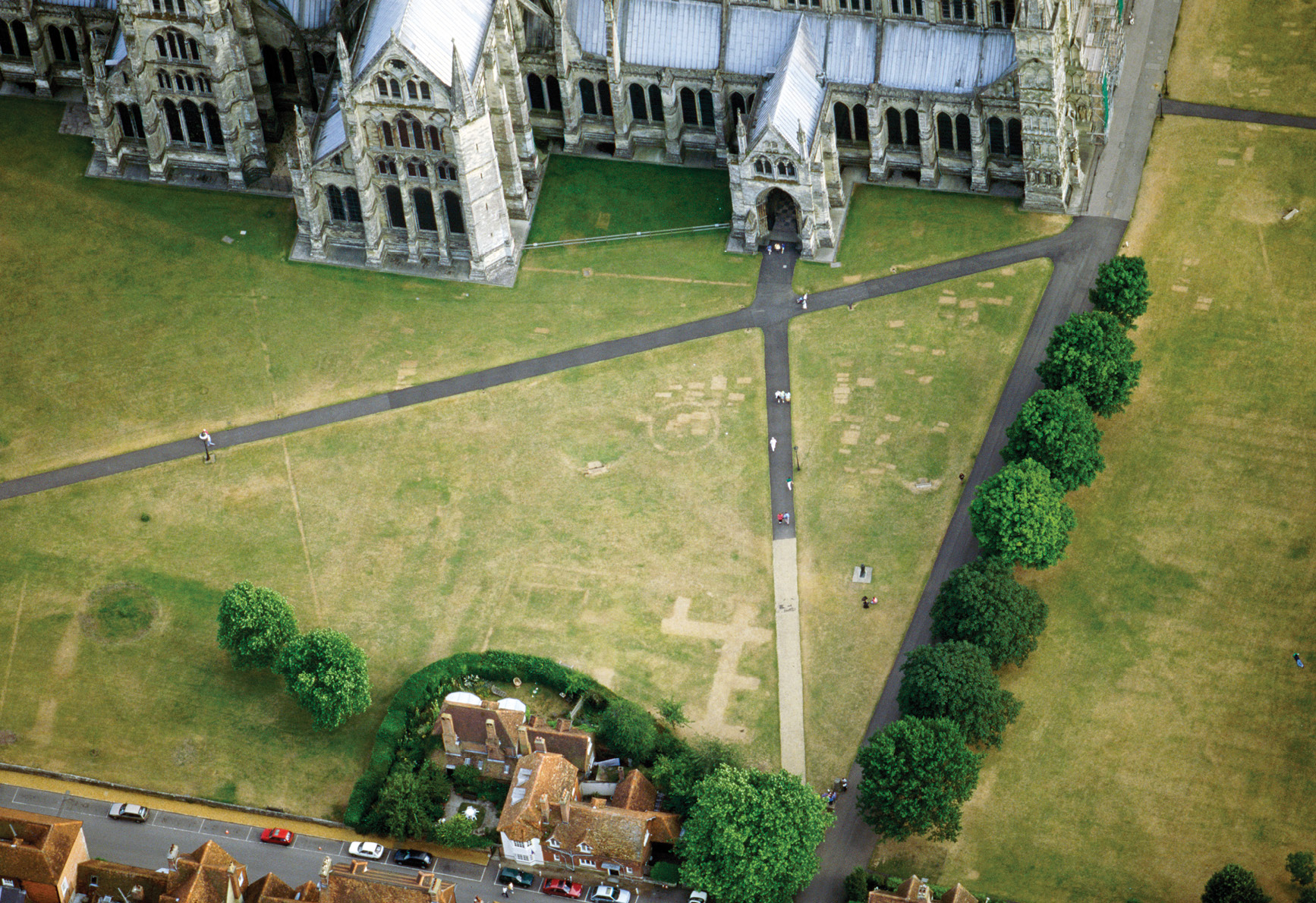 left Letters to The Times in the 1890s mention the marks of buried grave slabs and of a detached and buttressed bell tower visible as parch marks in the grass of Salisbury Cathedral Close. Those same features were visible again on 1 August 1994 when this picture was taken. far right Insall returned to Woodhenge over and over again: on 30 June 1926 he took this picture, which shows clearly the concentric circles of pits that were revealed to have held timber posts when Maud Cunningham began excavating the site later the same year, having seen Insall’s photographs.
