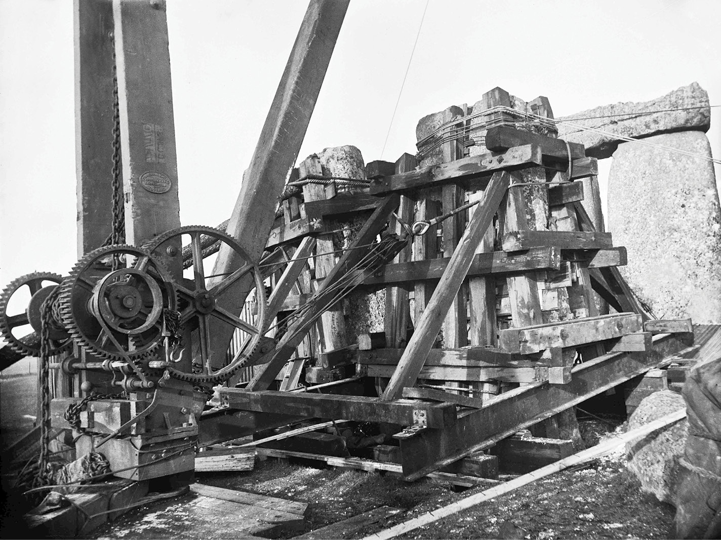 below left & below The controversial straightening of stone 56 in 1901. The photograph was taken by Clarissa Miles, a friend of the Antrobus family who owned Stonehenge at the time and employed the Arts and Crafts architect Detmar Blow to supervise the work. Even greater intervention saw the temporary removal of the lintel spanning uprights 6 and 7, whose stone holes were then excavated, the stones pushed to their presumed original vertical position, and the holes filled with concrete. The scale of this and other actions led archaeologist Christopher Chippindale to conclude that half of Stonehenge’s stratigraphy has been destroyed.