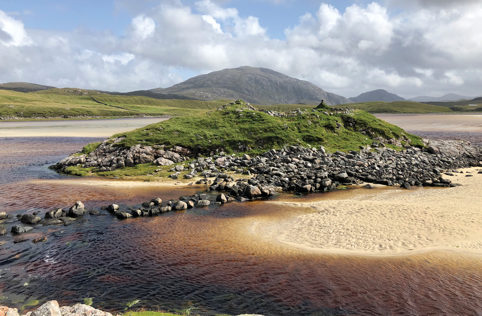 ABOVE The island dun of Dun Borranish on the Isle of Lewis, accessed via a stone causeway. In the eyes of Iron Age folk, was this all that distinctive from a crannog?