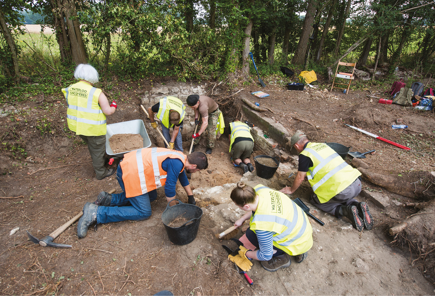 LEFT Archaeologists and VSMPs working in the basement of one of the buildings at Frischermont farm.