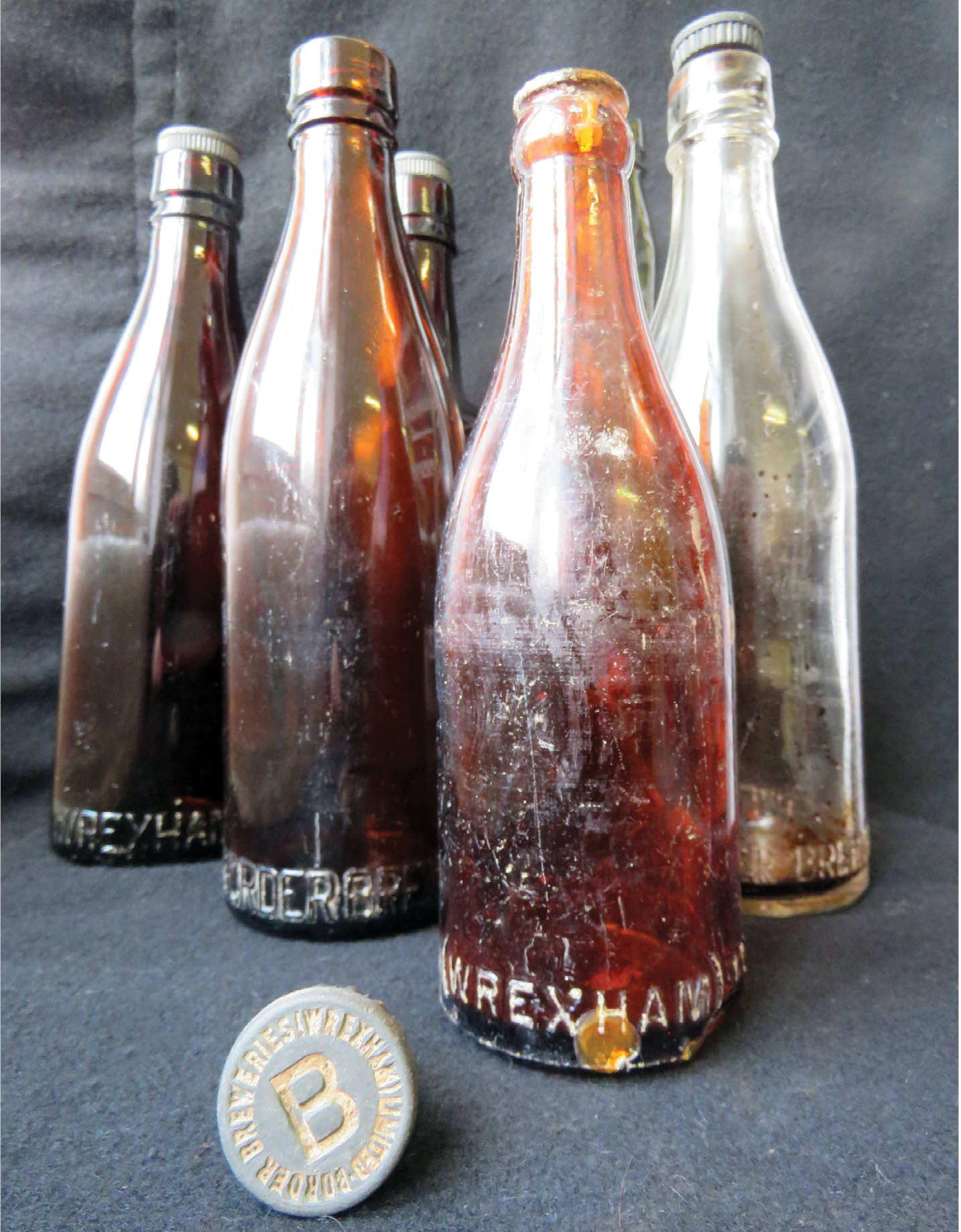left These bottles once contained beer made by Border Breweries in Wrexham; they were found during the excavation of a Second World War-era prisoner of war camp near Oswestry though it is not known whether their contents had been enjoyed by inmates or site staff.
