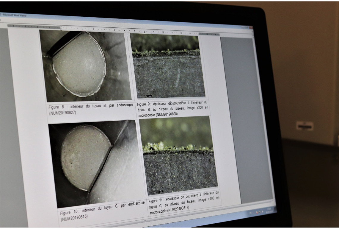 clockwise from far left Microscopic images of dust inside Notre Dame’s organ pipes; ; Aurélia Azéma carefully handles two lead pipes from the organ; scanning electron microscope reveals a nanoparticle of lead from a sample of dust from the organ seat. right Claudine Loisel examines dust on a panel of stained glass under a binocular microscope. below Blackened soot and dust on a panel of stained glass.